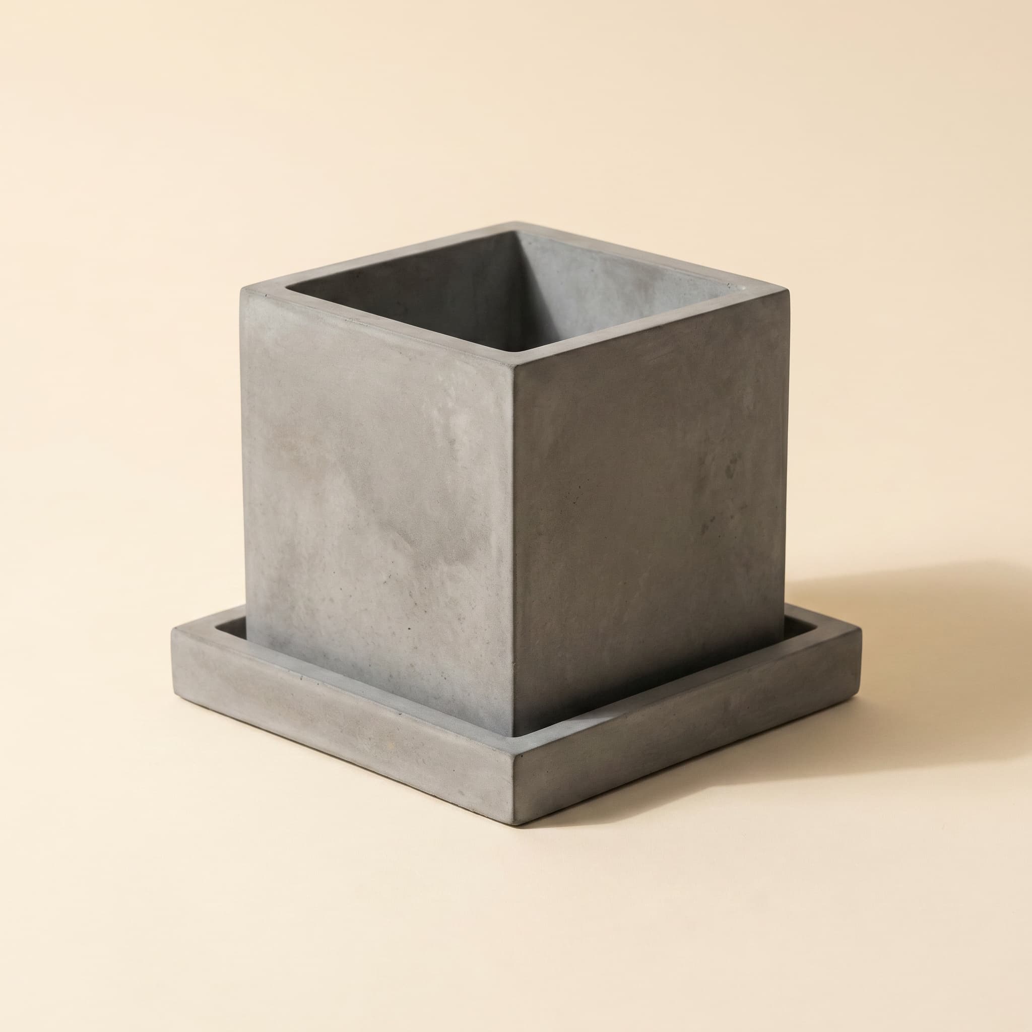 Grey cube vessel on matching square saucer