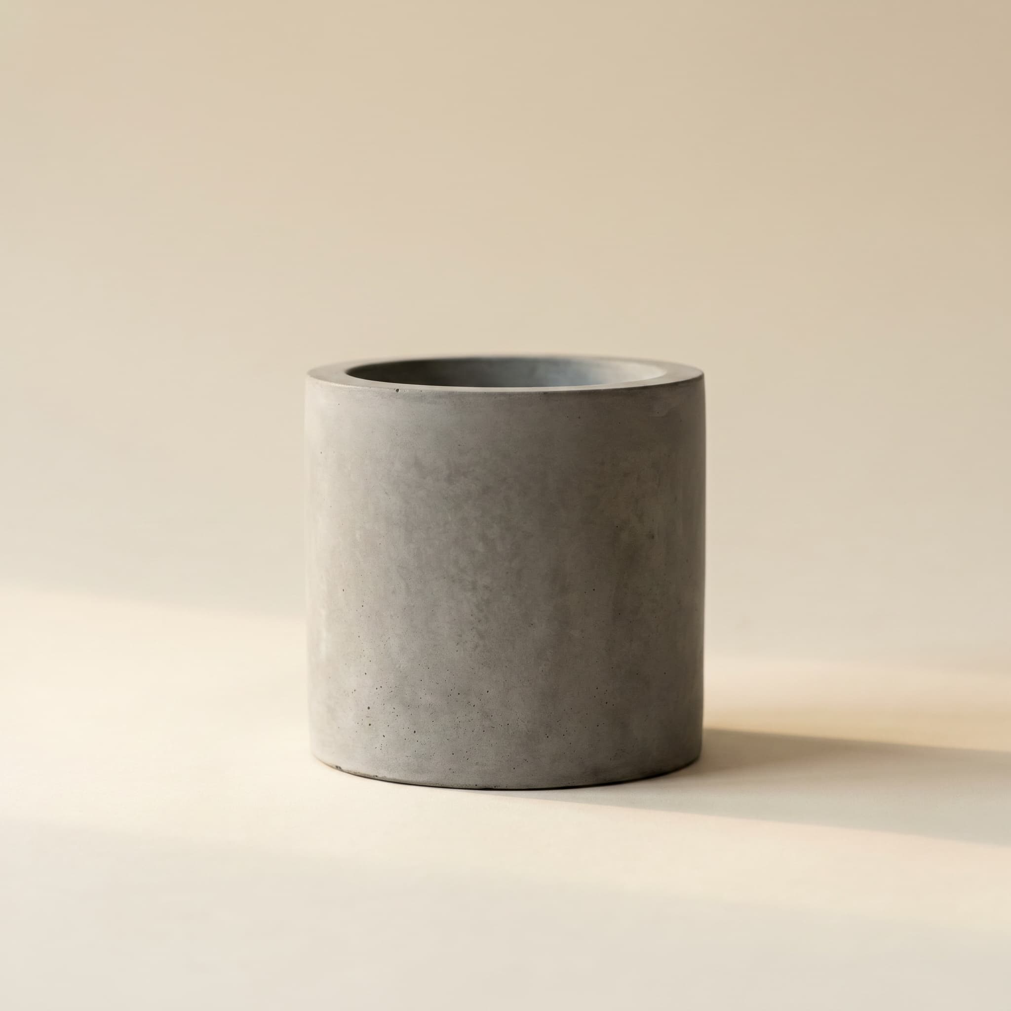 Small grey concrete cylinder vessel