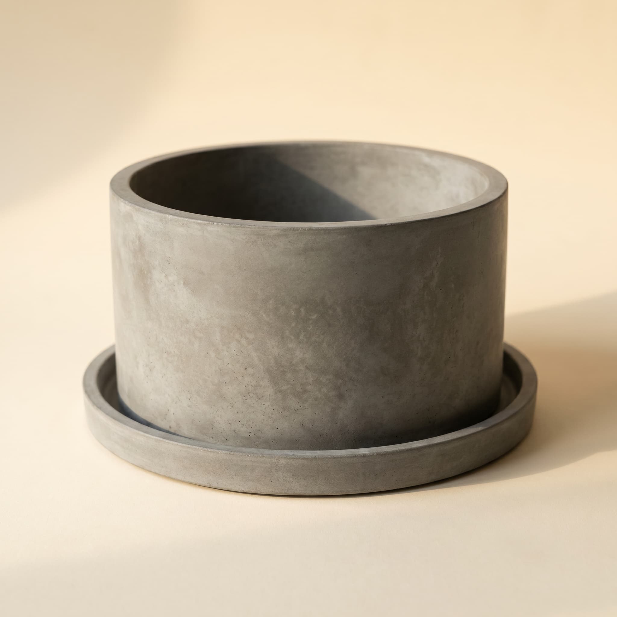 Wide grey vessel on matching round saucer