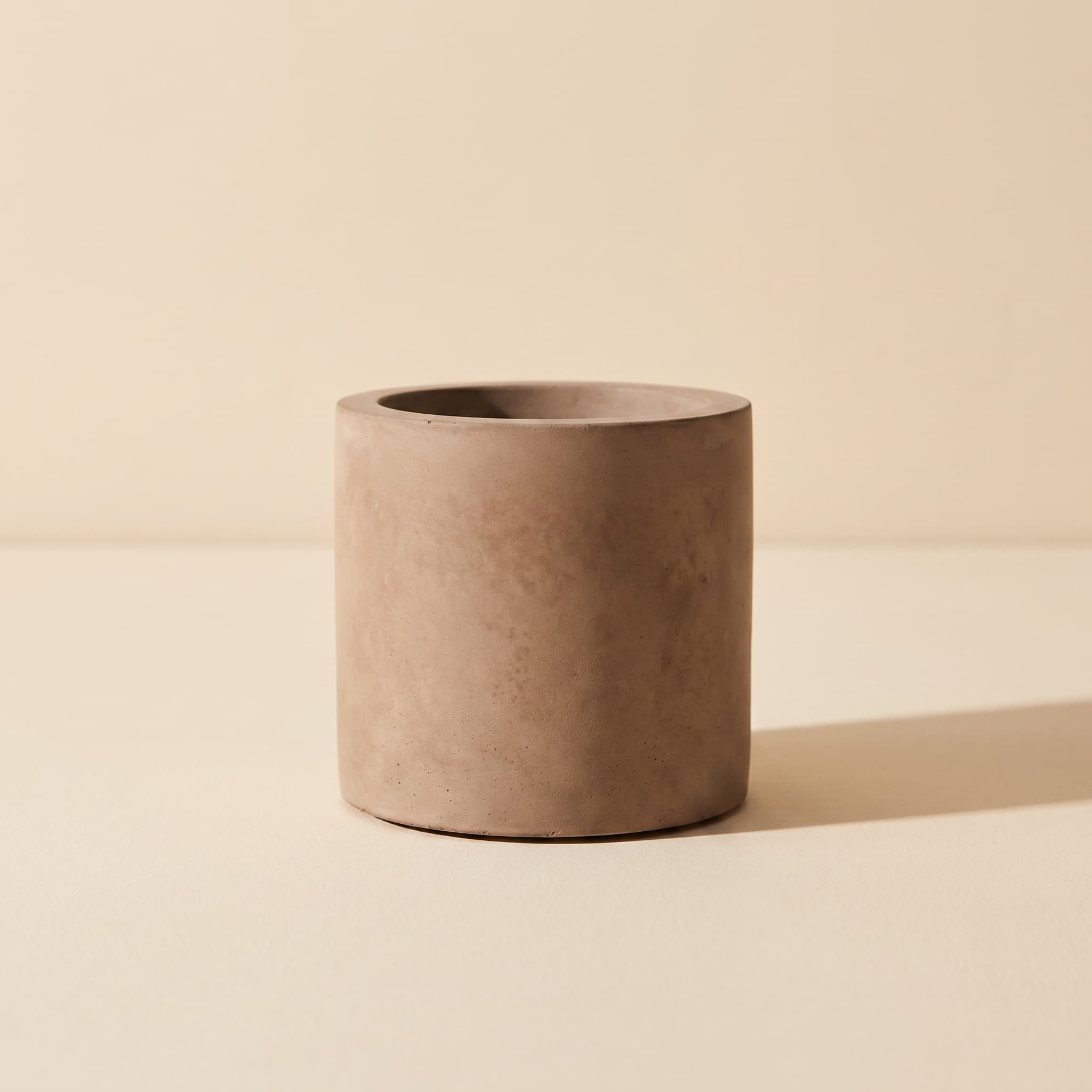 Small taupe concrete cylinder vessel