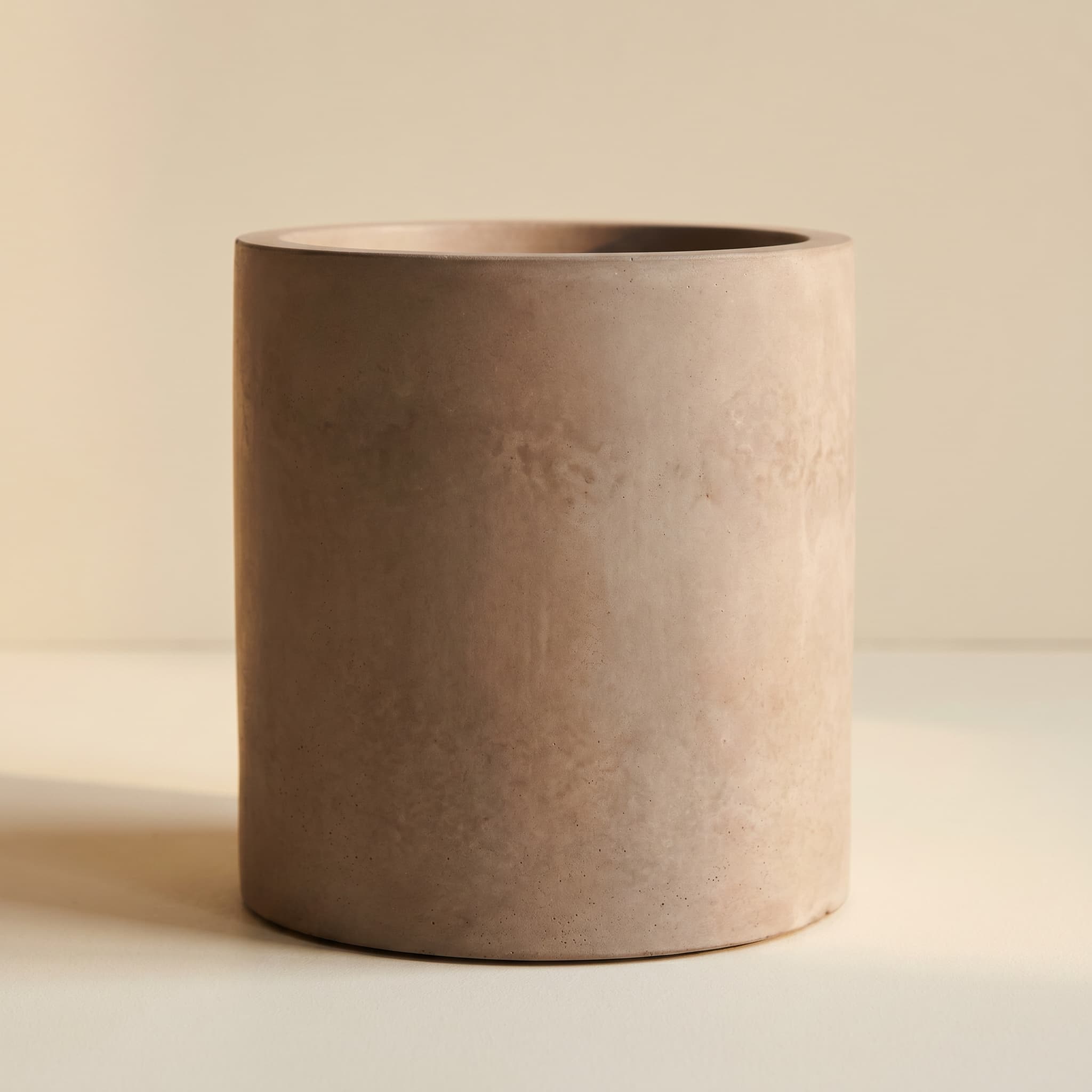 Tall taupe concrete cylinder vessel